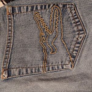 Wild retro lacoste jeans. Croc embroidered back pockets.